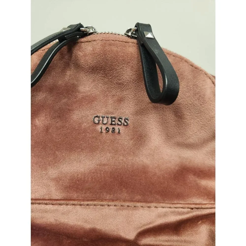 Guess small velvet feel pink backpack with black straps and pom. Measures approx